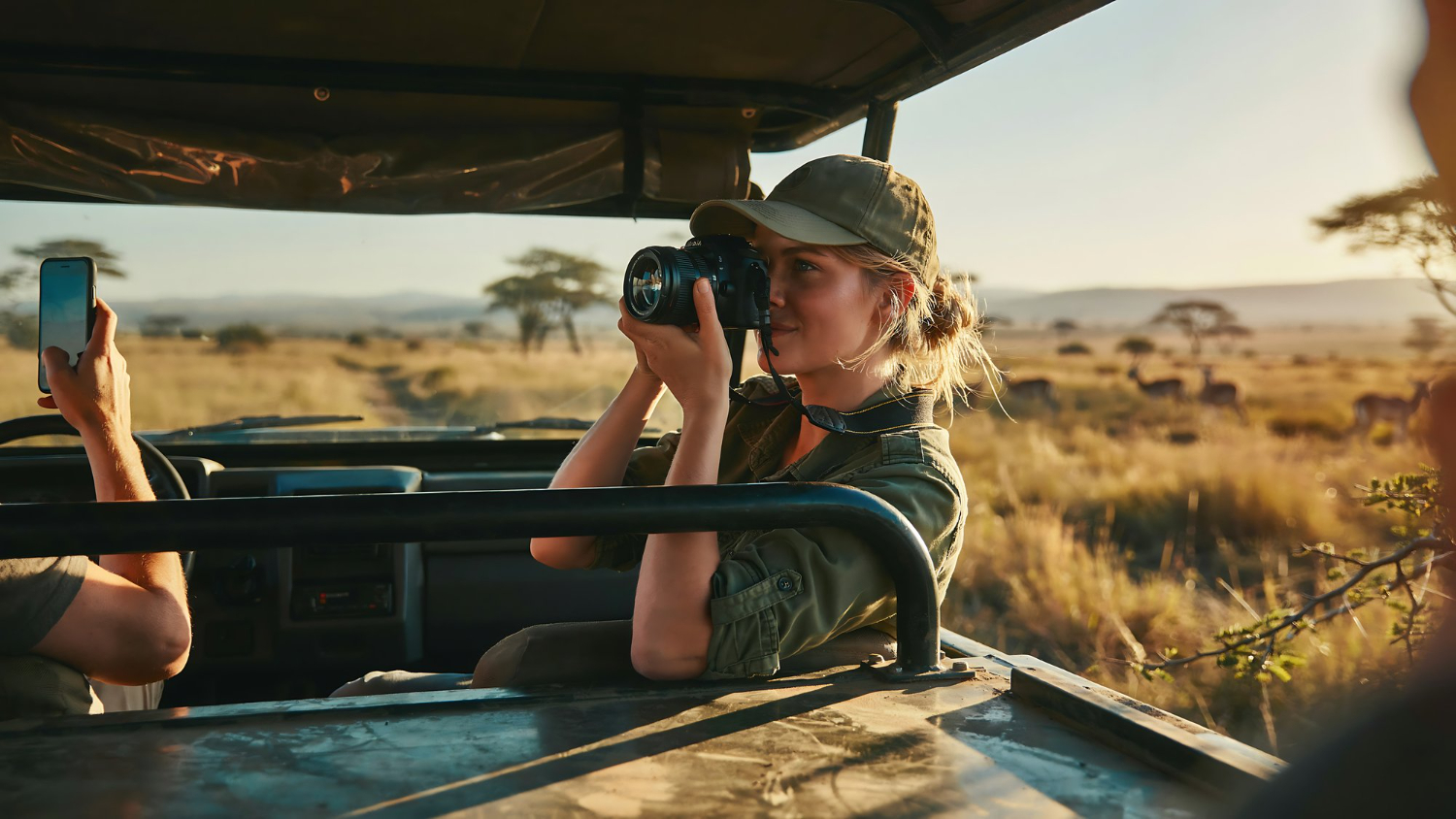 woman taking photos on safari