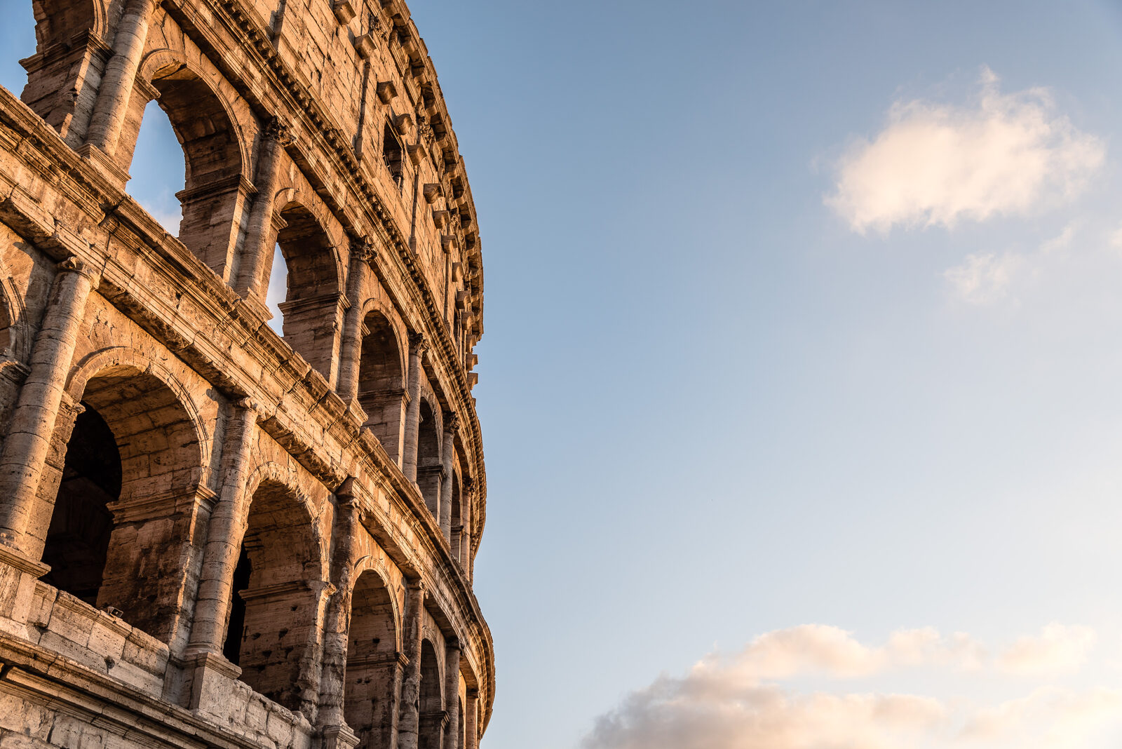 An old amphitheatre under a wide sky