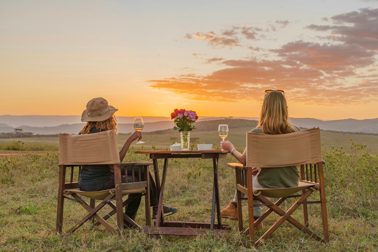A table laid for dinner overlooking the water at dusk