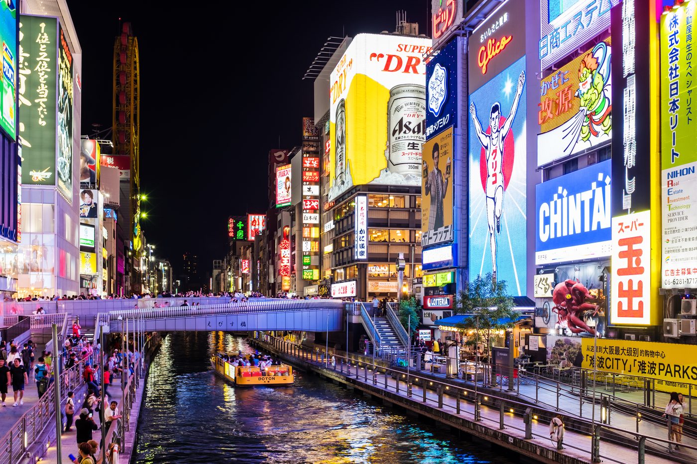 Neon signs above the canal at Dotonbori