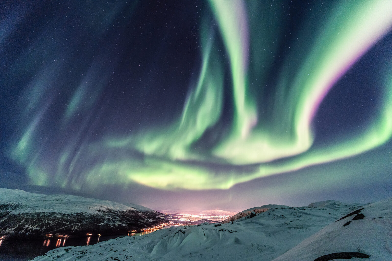 The northern lights over a still landscape