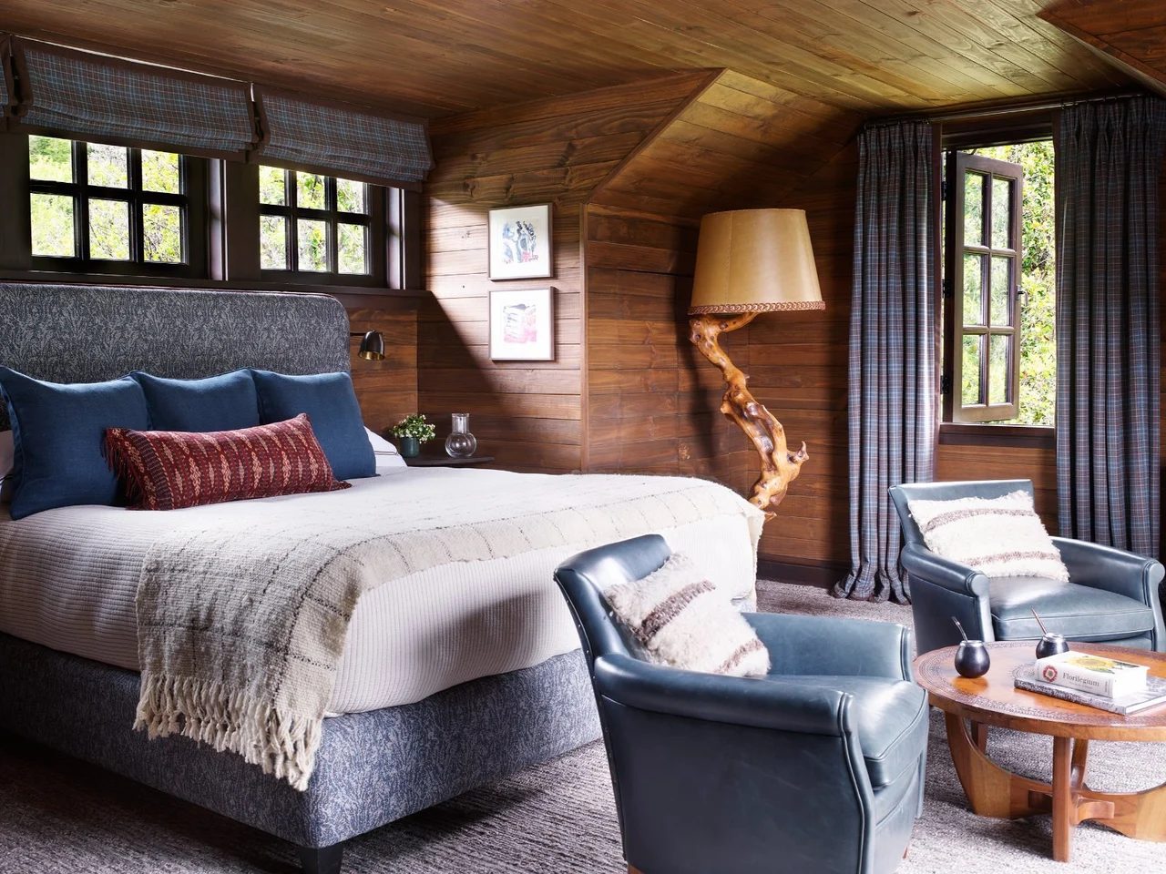 A room panelled in wood, looking out over the valley