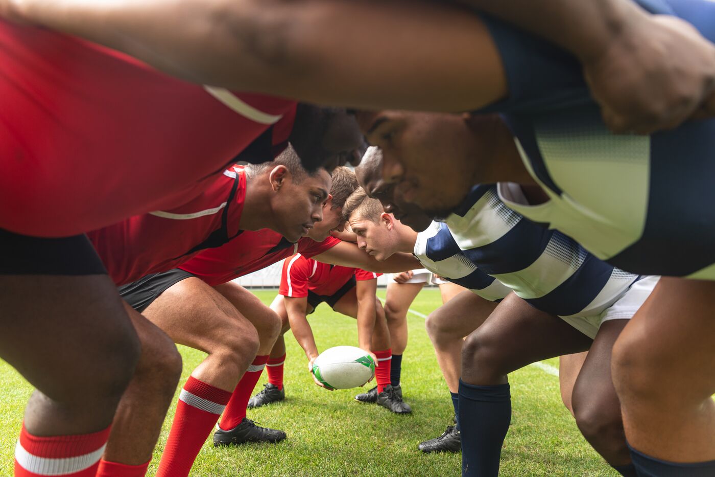Rugby forwards binding together as the ball comes into the scrum