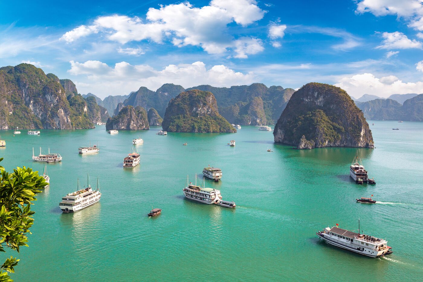 Cruise boats among the limestone islands of Ha Long Bay